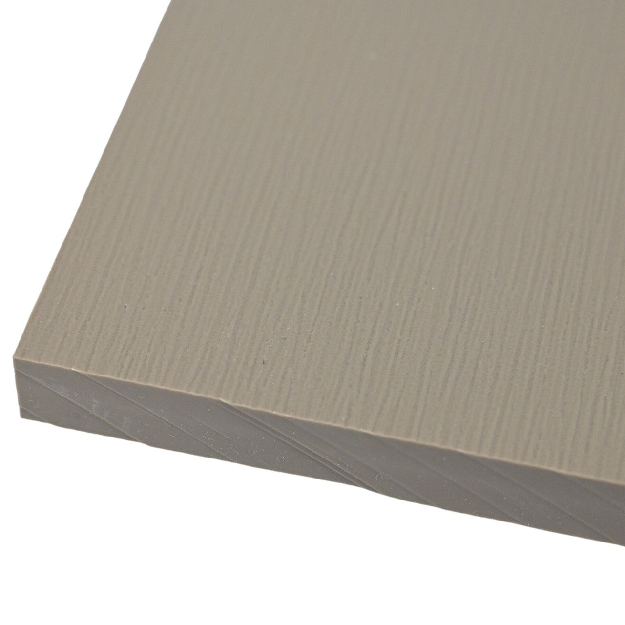 Close-up of a textured beige surface on a white background